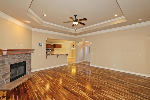9315 Gaston Ave, Amarillo, TX 79119 - unfurnished living room featuring a raised ceiling and ornamental molding