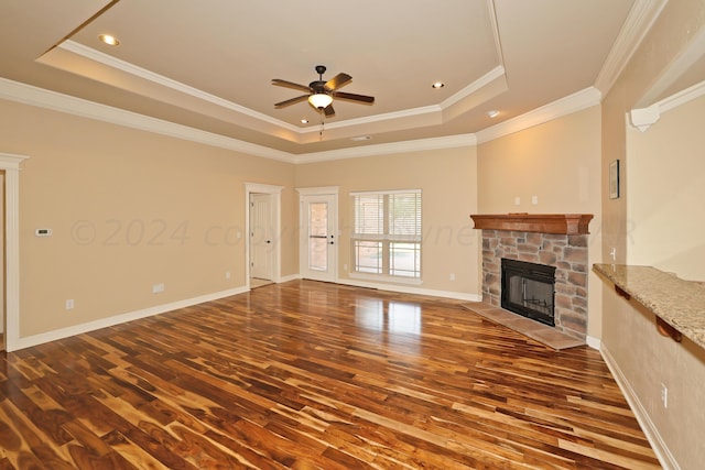 9315 Gaston Ave, Amarillo, TX 79119 - unfurnished living room with crown molding, ceiling fan, a raised ceiling, and a fireplace