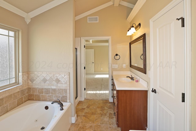 9315 Gaston Ave, Amarillo, TX 79119 - bathroom featuring vanity, a bathtub, ornamental molding, and lofted ceiling