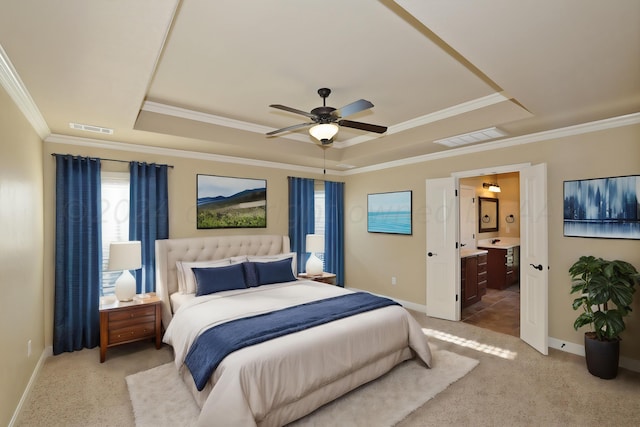 9315 Gaston Ave, Amarillo, TX 79119 - carpeted bedroom featuring ceiling fan, crown molding, connected bathroom, and a tray ceiling
