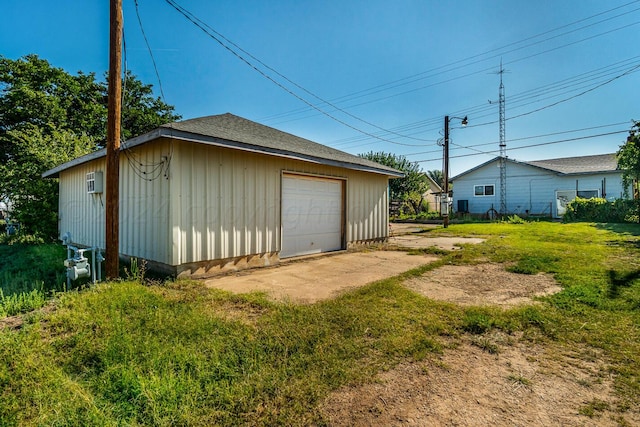 garage featuring a yard