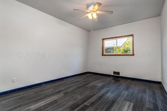 unfurnished room with ceiling fan and dark hardwood / wood-style floors