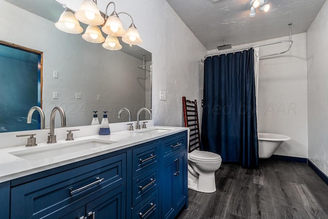 bathroom featuring hardwood / wood-style floors, vanity, and toilet