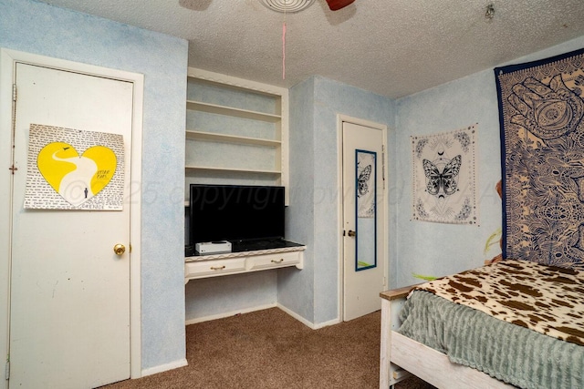 5216 Westway Trl, Amarillo, TX 79109 - bedroom with dark carpet, a textured ceiling, and an office area
