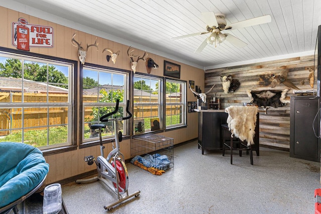 5216 Westway Trl, Amarillo, TX 79109 - exercise area featuring wood walls, healthy amount of natural light, a ceiling fan, and wooden ceiling