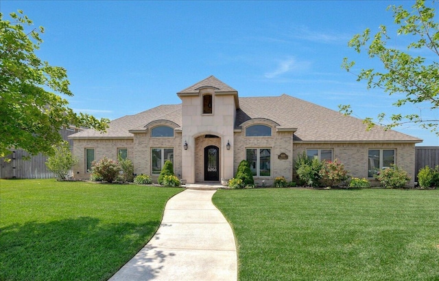8205 S Liberty Cir, Amarillo, TX 79119 - french country style house with brick siding and roof with shingles