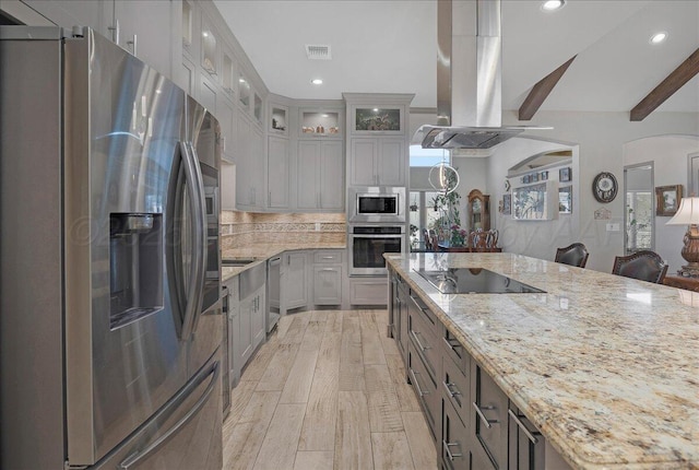 8205 S Liberty Cir, Amarillo, TX 79119 - kitchen with appliances with stainless steel finishes, island exhaust hood, light stone countertops, beamed ceiling, and recessed lighting
