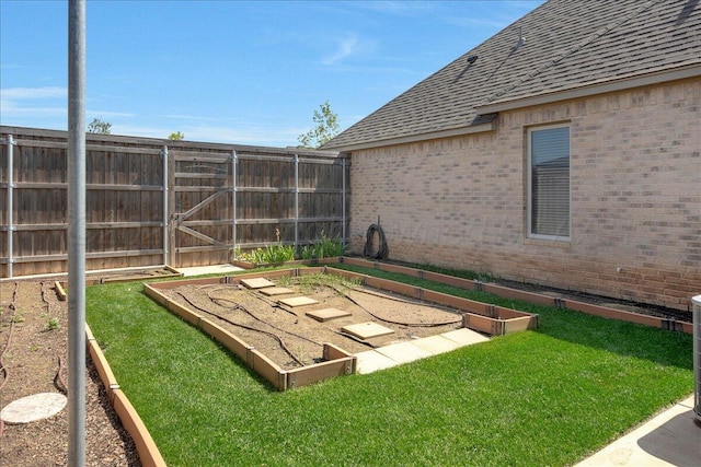 8205 S Liberty Cir, Amarillo, TX 79119 - fenced backyard featuring a garden