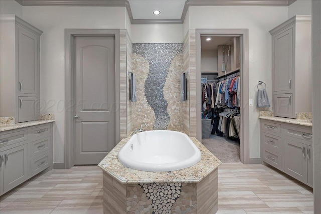 8205 S Liberty Cir, Amarillo, TX 79119 - bathroom featuring ornamental molding, a bath, recessed lighting, and a walk in closet