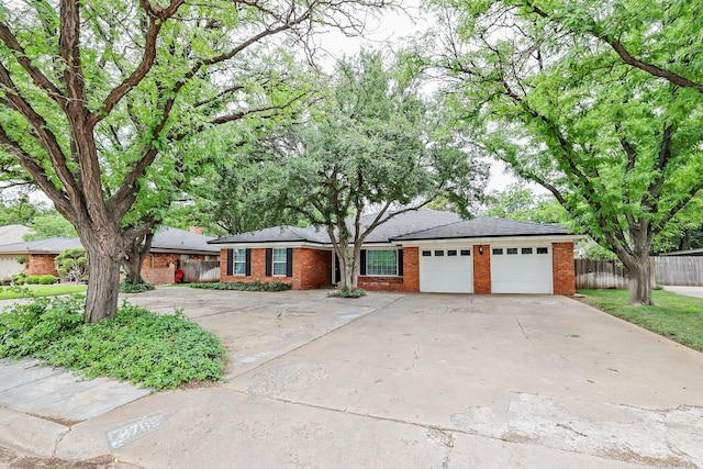 single story home featuring a garage