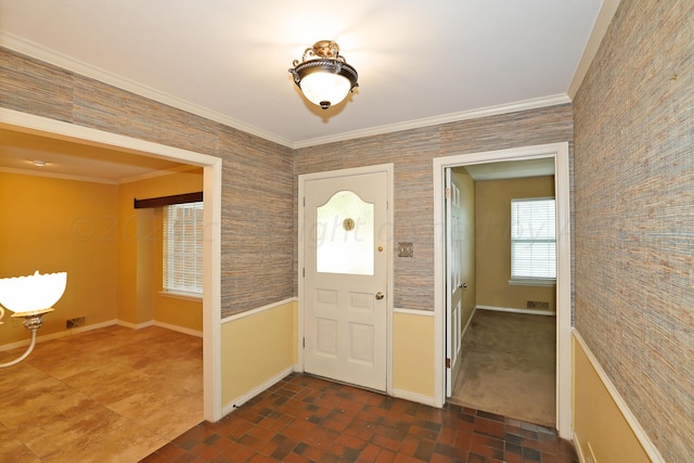 entrance foyer featuring ornamental molding