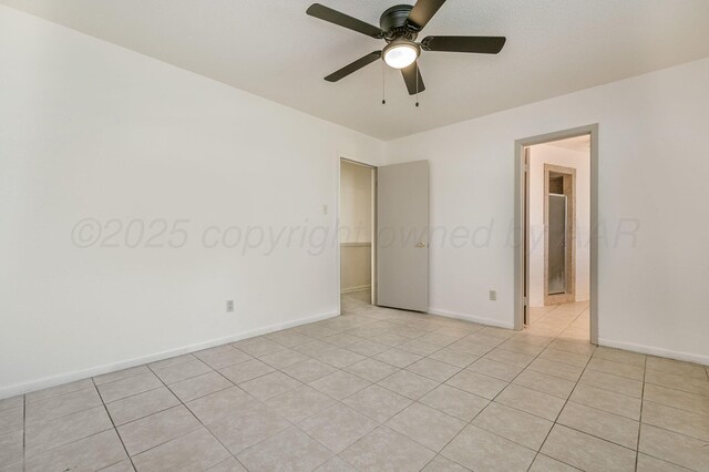 4720 Cherokee Trl, Amarillo, TX 79109 - empty room with a ceiling fan and light tile patterned floors