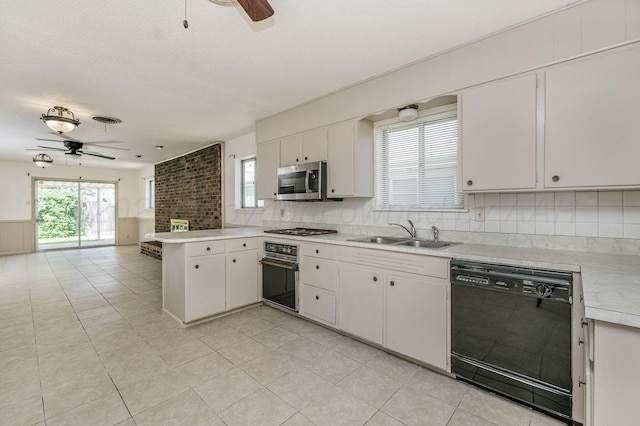 4720 Cherokee Trl, Amarillo, TX 79109 - kitchen with black appliances, a ceiling fan, a peninsula, light countertops, and healthy amount of natural light