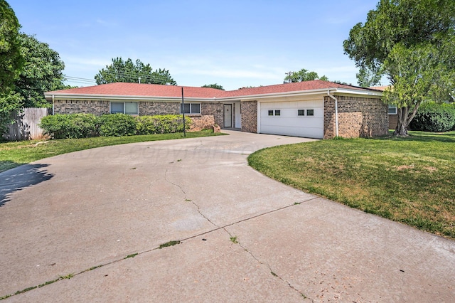 4720 Cherokee Trl, Amarillo, TX 79109 - ranch-style home featuring a garage, concrete driveway, and brick siding