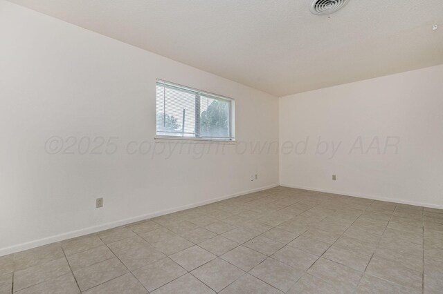 4720 Cherokee Trl, Amarillo, TX 79109 - empty room with baseboards and light tile patterned floors