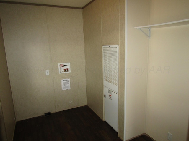 laundry room featuring dark hardwood / wood-style flooring and hookup for a washing machine