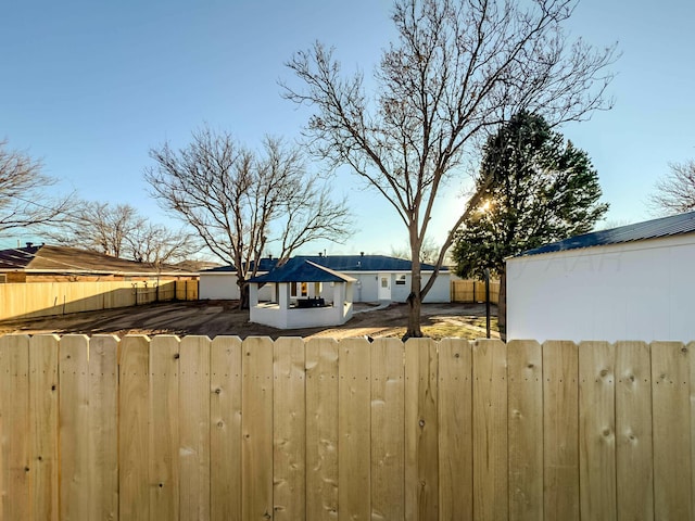 view of yard with fence private yard and a gazebo