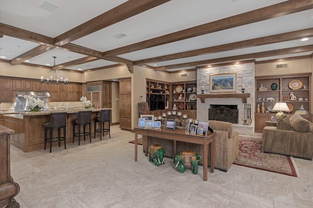 3506 Van Winkle Dr, Amarillo, TX 79121 - living room featuring beam ceiling, a chandelier, visible vents, and a fireplace