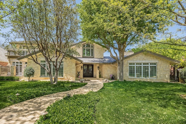 3506 Van Winkle Dr, Amarillo, TX 79121 - traditional-style home featuring french doors, roof with shingles, stone siding, and a front lawn