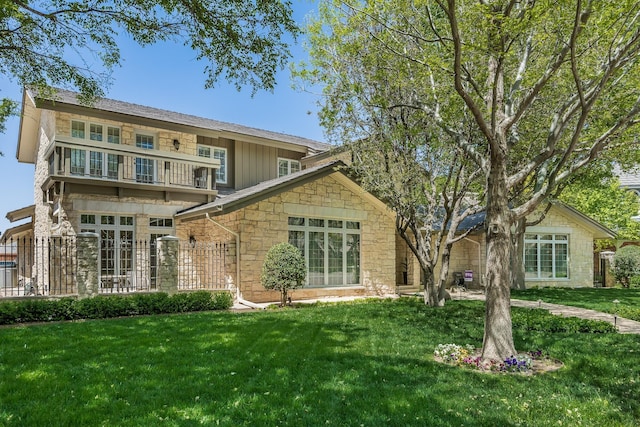 3506 Van Winkle Dr, Amarillo, TX 79121 - back of house with a lawn, stone siding, and a balcony
