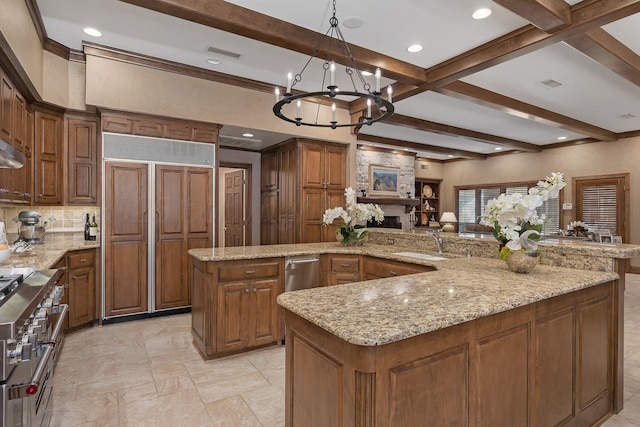 3506 Van Winkle Dr, Amarillo, TX 79121 - kitchen featuring visible vents, beam ceiling, premium appliances, and a sink