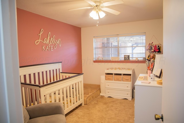 1418 Oak Ave, Panhandle, TX 79068 - bedroom with light carpet, a crib, and ceiling fan
