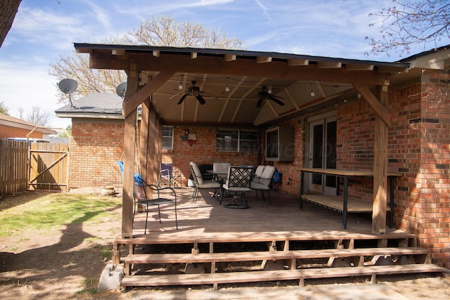 1418 Oak Ave, Panhandle, TX 79068 - deck with ceiling fan, outdoor dining area, and a gate