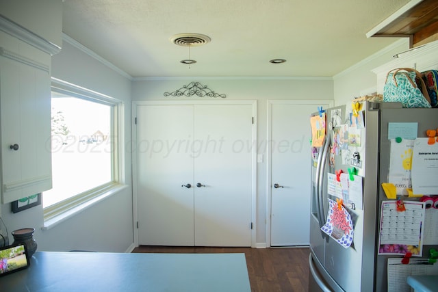 1418 Oak Ave, Panhandle, TX 79068 - kitchen with stainless steel fridge with ice dispenser, dark wood-style flooring, and crown molding