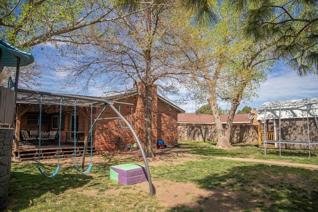 1418 Oak Ave, Panhandle, TX 79068 - view of yard with a trampoline and a deck