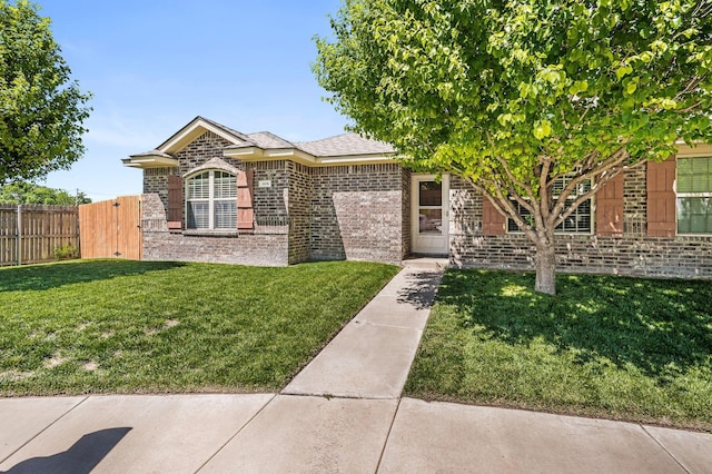 view of front of home featuring brick siding