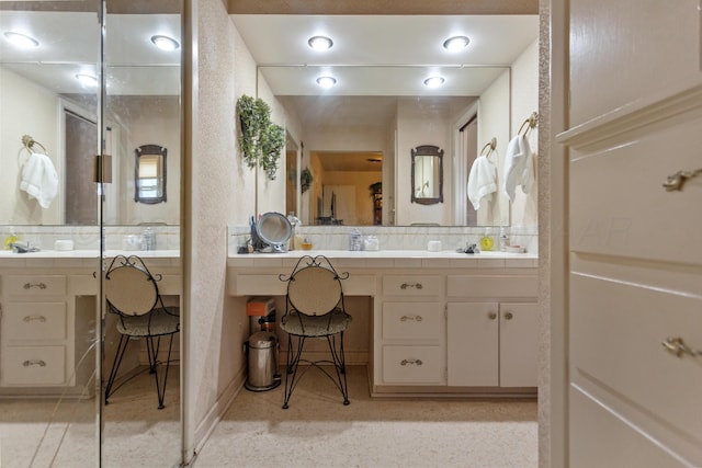 full bathroom with vanity and decorative backsplash