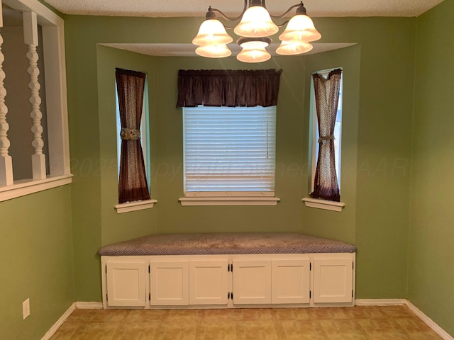 6812 Blacksmith Ln, Amarillo, TX 79109 - unfurnished dining area featuring a chandelier and baseboards