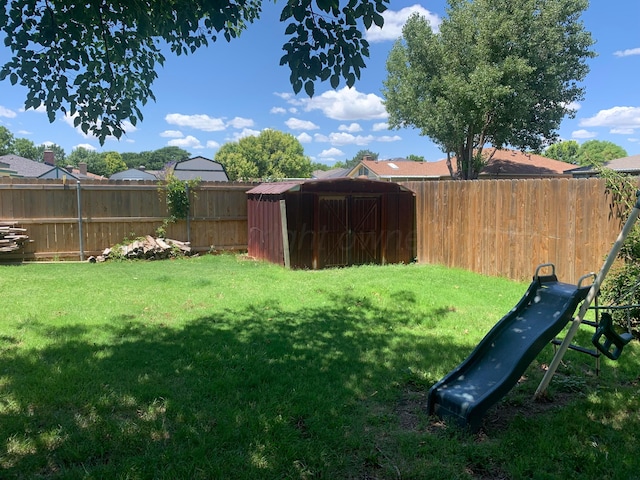 6812 Blacksmith Ln, Amarillo, TX 79109 - fenced backyard featuring a storage unit