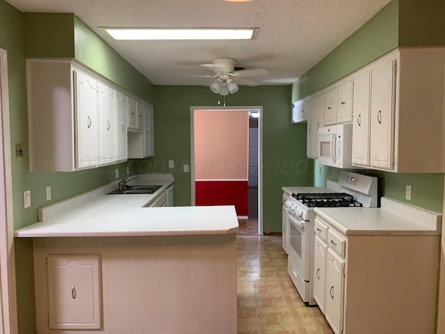 6812 Blacksmith Ln, Amarillo, TX 79109 - kitchen with white appliances, white cabinetry, and a peninsula