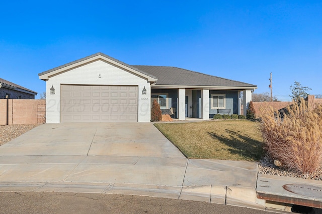 ranch-style home featuring driveway, an attached garage, fence, a front yard, and brick siding