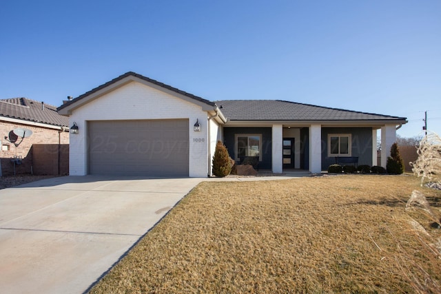 ranch-style home with brick siding, concrete driveway, an attached garage, a front yard, and a tiled roof