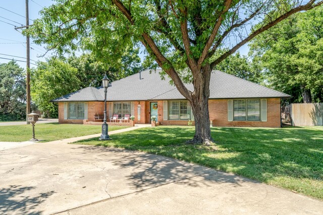 4512 Gem Lake Rd, Amarillo, TX 79106 - view of front of home featuring brick siding and roof with shingles