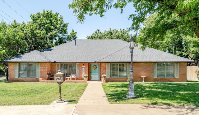 4512 Gem Lake Rd, Amarillo, TX 79106 - view of front facade with brick siding and a shingled roof