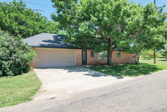 4512 Gem Lake Rd, Amarillo, TX 79106 - view of front of property with a garage, driveway, a front yard, and brick siding