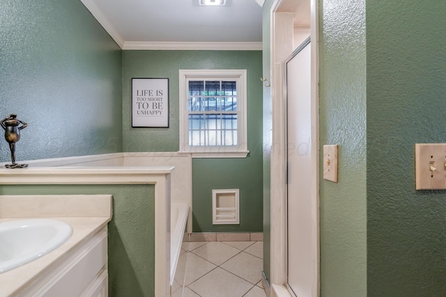 4512 Gem Lake Rd, Amarillo, TX 79106 - bathroom featuring a textured wall, ornamental molding, a garden tub, tile patterned flooring, and vanity