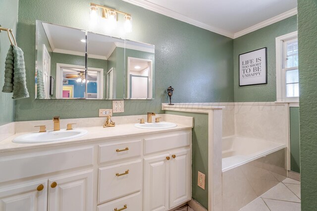 4512 Gem Lake Rd, Amarillo, TX 79106 - bathroom with double vanity, a textured wall, tile patterned floors, ornamental molding, and a garden tub
