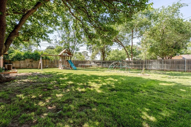 4512 Gem Lake Rd, Amarillo, TX 79106 - fenced backyard featuring a playground