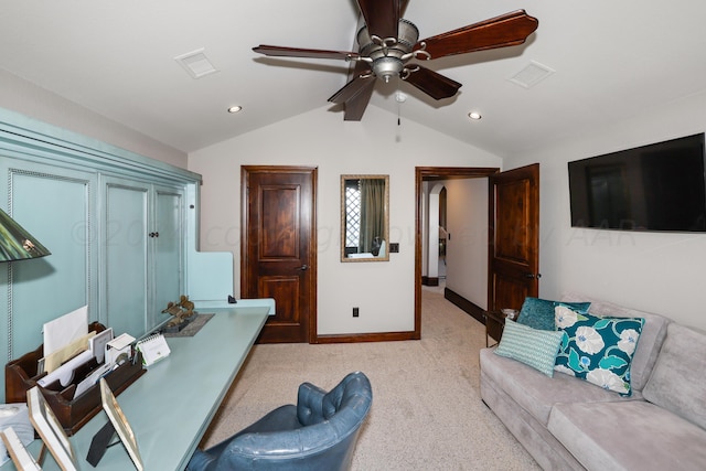 carpeted office space featuring lofted ceiling and ceiling fan