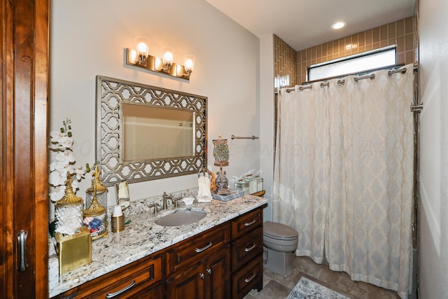 bathroom with vanity, walk in shower, and toilet