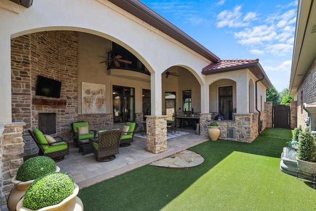 view of patio featuring ceiling fan