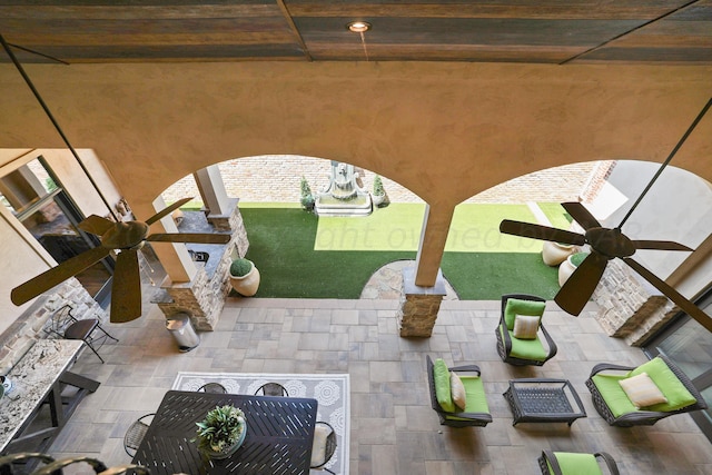 view of patio / terrace featuring ceiling fan