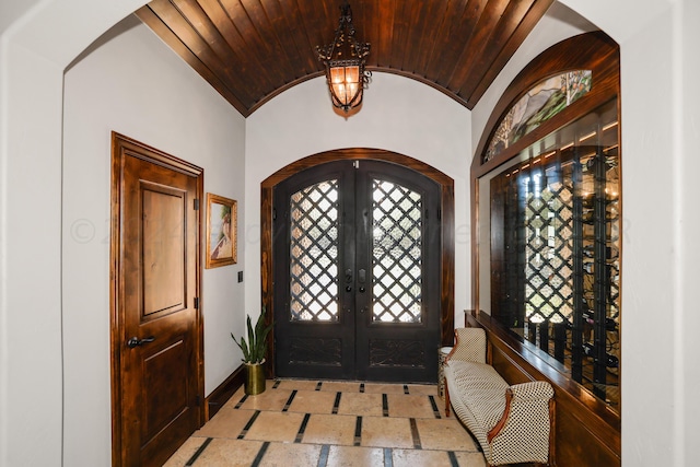 foyer entrance with vaulted ceiling and french doors