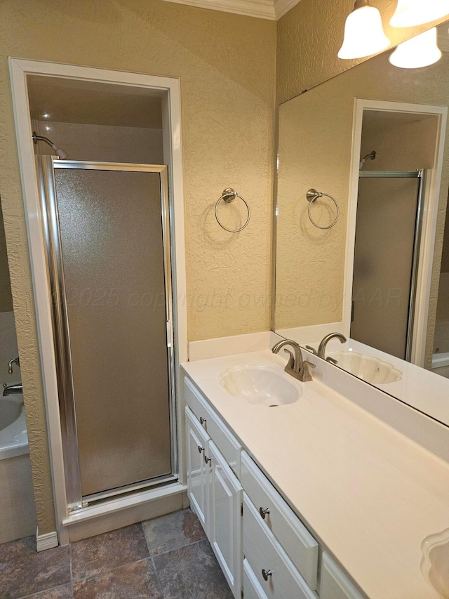 7205 Columbia Ln, Amarillo, TX 79109 - bathroom with a textured wall, vanity, a shower stall, and a tub to relax in