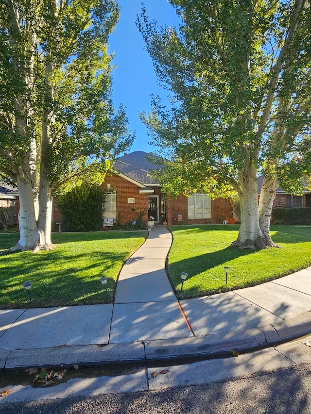 view of front of property with a front lawn