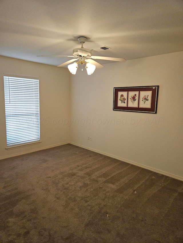 7205 Columbia Ln, Amarillo, TX 79109 - spare room featuring dark colored carpet and ceiling fan